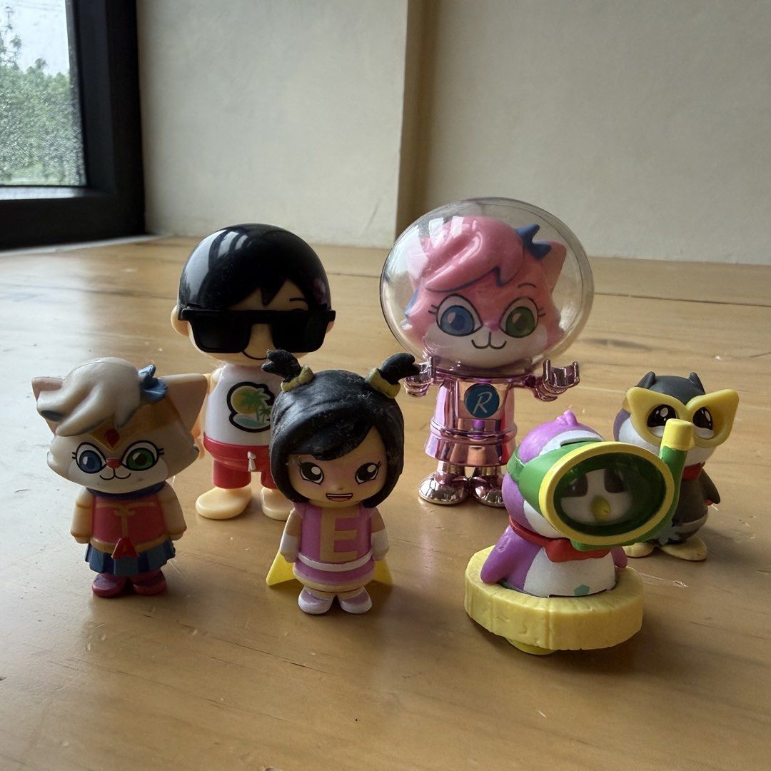 Ryan's World and Friends Action Figure Set (Category: Figurines & Statues) located in Calamba. Submitted by letsygread9 (Listing ID 1454759146, Image 1). Description: Expect some scratches and signs of use - Collection of fun action figures. - Features characters like Ryan, a pink cat in a space helmet, a girl with pigtails, a penguin diver, and an owl. - Ideal for fans of Ryan's World and similar shows..