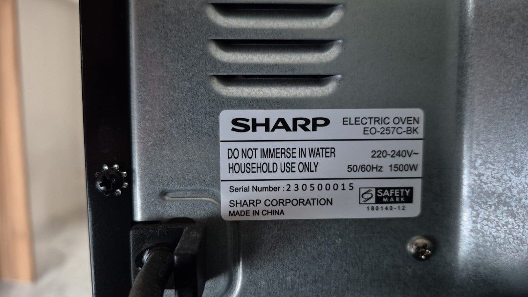Sharp Oven (Category: Ovens & Toasters) located in Singapore. Submitted by usaoutlets (Listing ID 1454823964, Image 3). Description: - Sharp oven in good working condition. - Comes with multiple racks for versatile cooking. - Features adjustable temperature controls. - Full-door opening for easy loading and unloading. - Minor signs of use inside, as pictured..