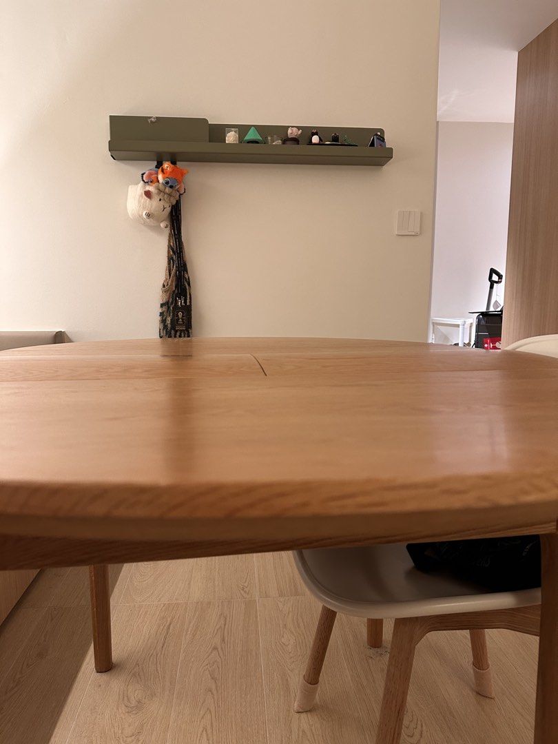 Solid wood dining table (Category: Tables & Sets) located in Singapore. Submitted by supiyamy (Listing ID 1454808512, Image 3). Description: Solid wood table, slightly warped as can be seen in the photo. Think of it like a wavy (?) table top! It is expandable. Dimensions - Before expanding: 100x100cm - After expanding: 100x130cm It still works find as a table just not flat! Looking to quickly sell by first week September. Moving and dismantling n