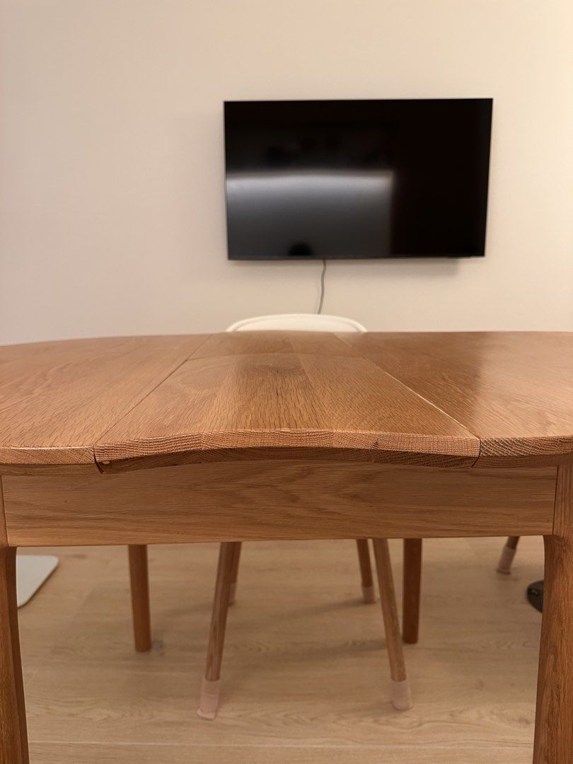 Solid wood dining table (Category: Tables & Sets) located in Singapore. Submitted by supiyamy (Listing ID 1454808512, Image 2). Description: Solid wood table, slightly warped as can be seen in the photo. Think of it like a wavy (?) table top! It is expandable. Dimensions - Before expanding: 100x100cm - After expanding: 100x130cm It still works find as a table just not flat! Looking to quickly sell by first week September. Moving and dismantling n