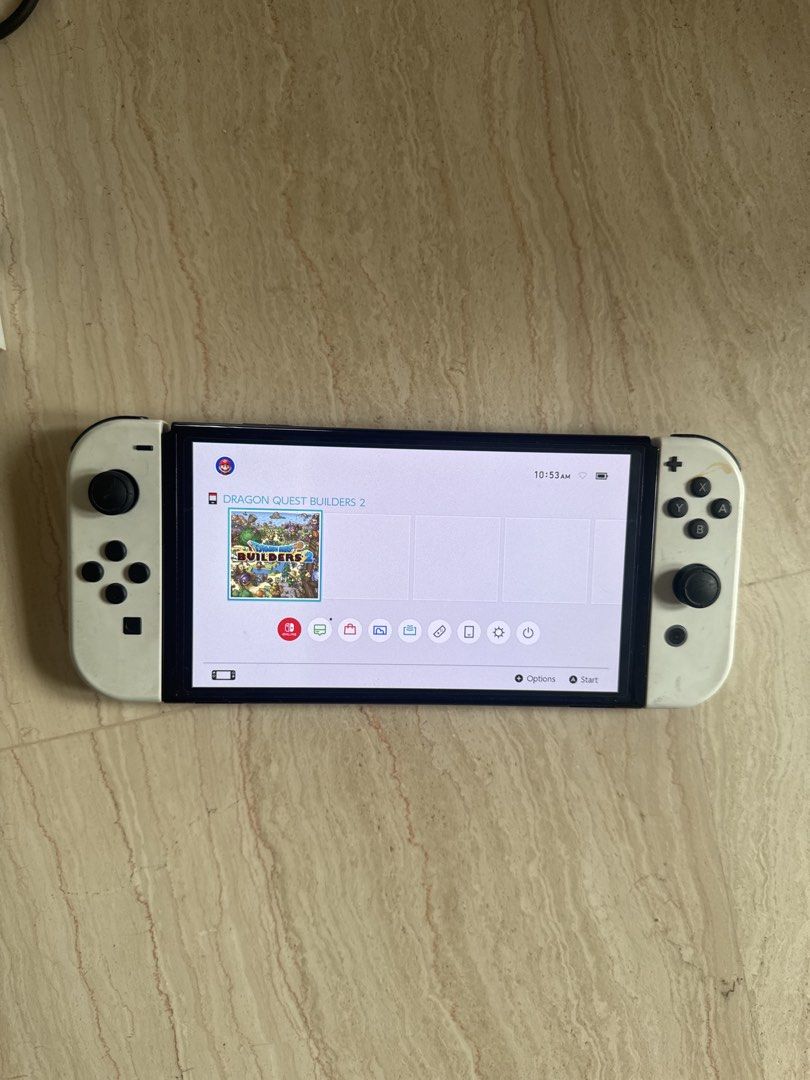 Switch Oled Set (Category: Nintendo) located in Singapore. Submitted by gingyassault (Listing ID 1454753306, Image 2). Description: 1x Switch Oled 1x Controller with case 2x joycons (read desc) 1x dock 1x power adapter 1x Dragon quest builders 2 game As you can see in the pictures, the joycons and the dock aren’t in pristine condition. joycons work with no drift, though you can see the right one the right joycon is a little loose. I will include 
