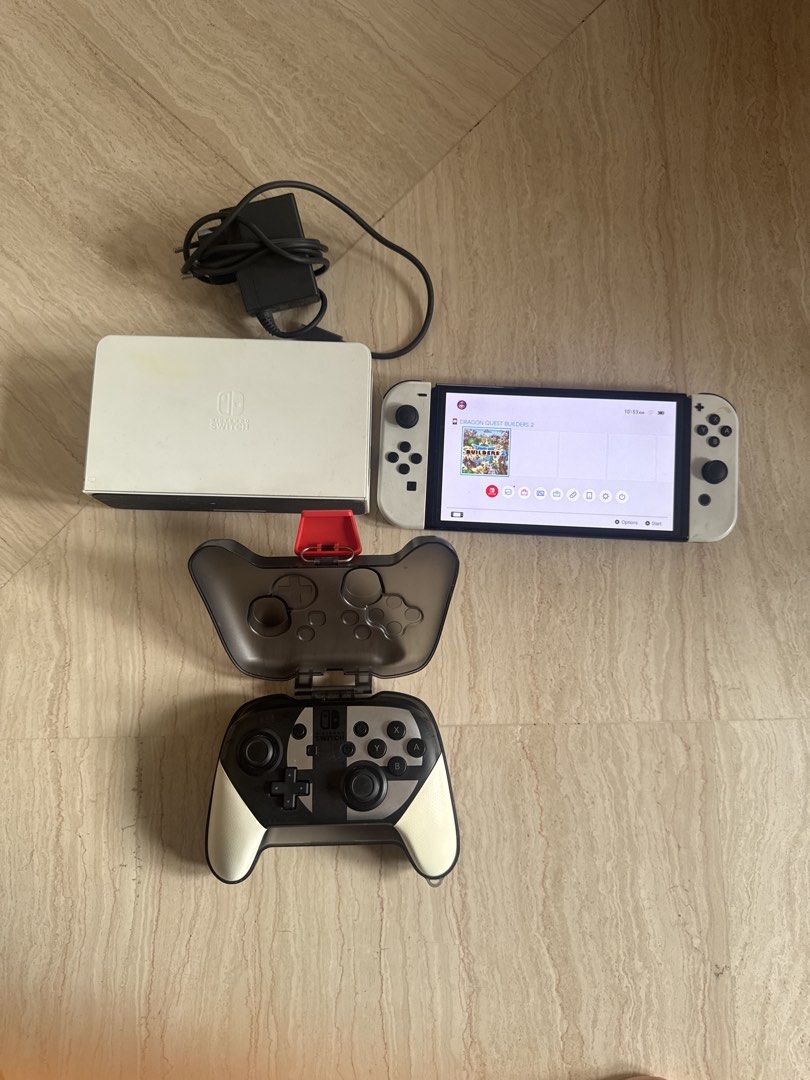 Switch Oled Set (Category: Nintendo) located in Singapore. Submitted by gingyassault (Listing ID 1454753306, Image 1). Description: 1x Switch Oled 1x Controller with case 2x joycons (read desc) 1x dock 1x power adapter 1x Dragon quest builders 2 game As you can see in the pictures, the joycons and the dock aren’t in pristine condition. joycons work with no drift, though you can see the right one the right joycon is a little loose. I will include 