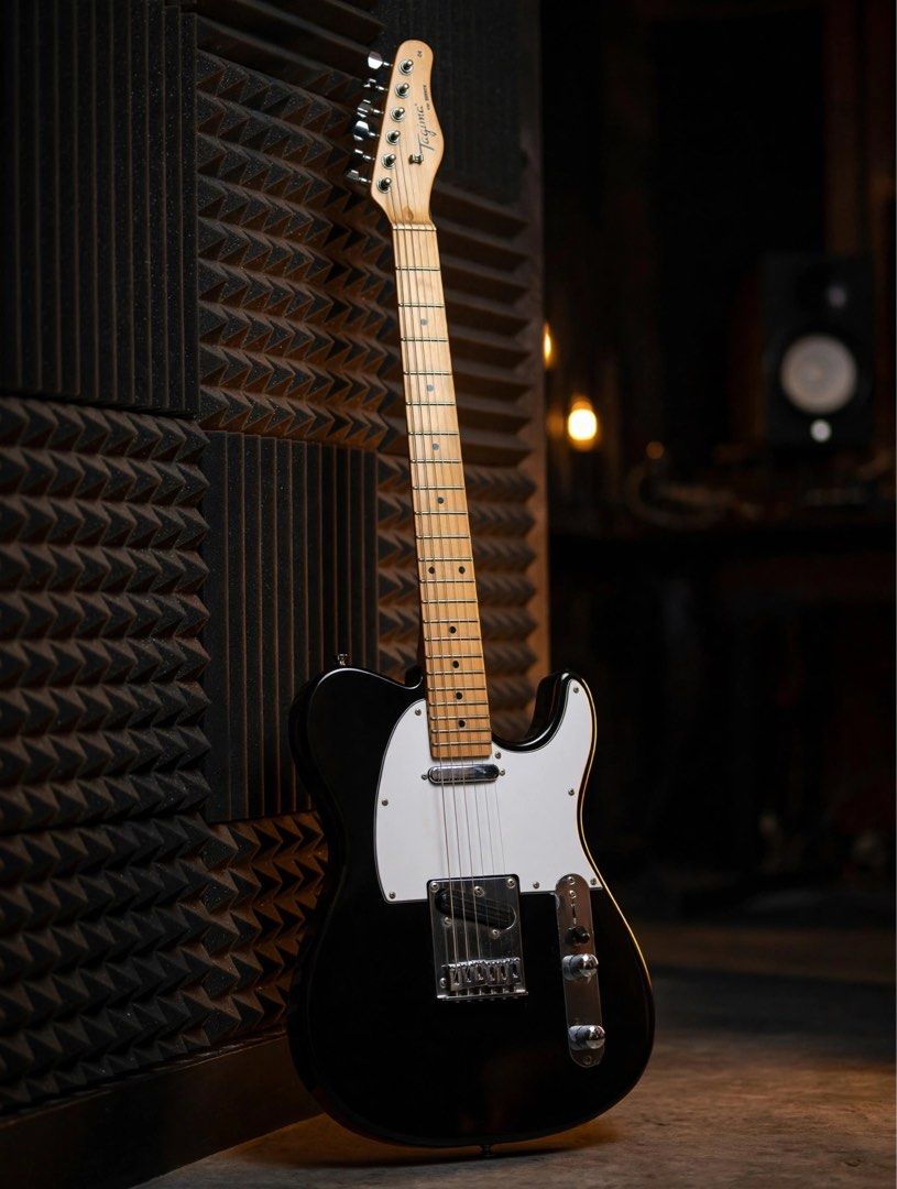 Tagima TW Series Electric Guitar - Black (Category: Musical Instruments) located in Bacoor. Submitted by frake5000 (Listing ID 1454905929, Image 2). Description: - Brand: Tagima - Model: TW Series - Style: Telecaster-style electric guitar - Neck Material: Maple - Fretboard Material: Maple - Color: Black - Condition: Ready for a new home, great for playing music. Upgraded: Bridge pickup to Alnico 5 ceramic hot rail. Original D’addario 10-52 string