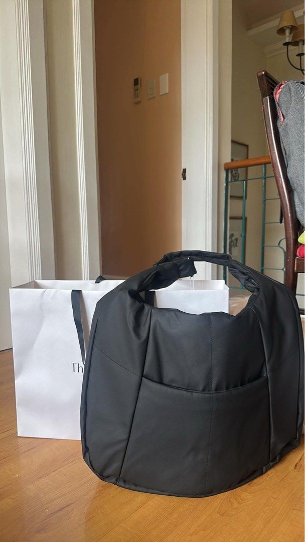 The Paper Bunny Puffer Carryall Black (Category: Tote Bags) located in Binan City. Submitted by kpreloved___ (Listing ID 1454785981, Image 1). Description: Bought for 6690 Brand new - Oversized black puffer carryall from The Paper Bunny - Ideal for gym-to-work transitions - Adjustable strap for comfortable carrying - Includes a clip-on drawstring pouch - Multiple interior compartments - Dedicated laptop slot - Built-in bottle holder - Brand new, 