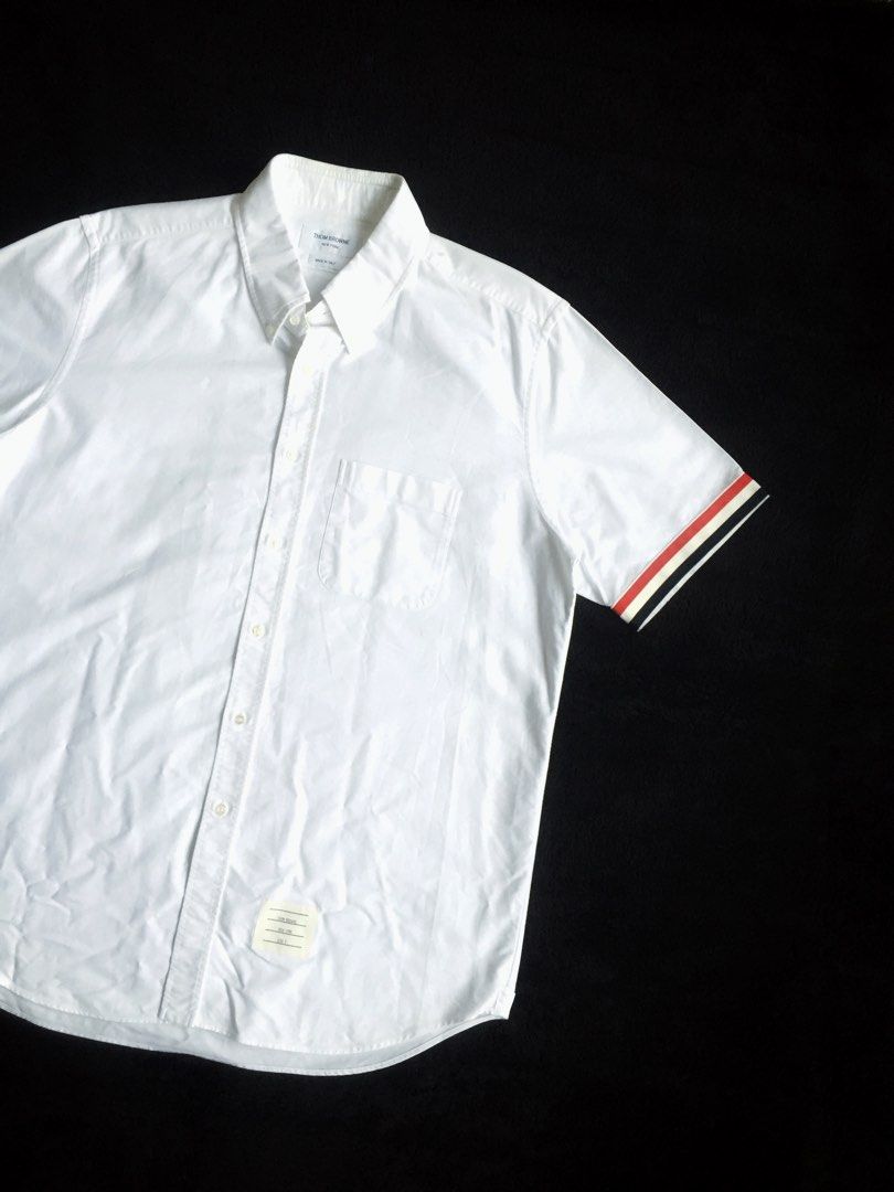 Thom Browne RWB Stripe Edge Oxford Button Down Shirt (Category: Luxury Apparel) located in Dinalupihan. Submitted by thriftout.ph (Listing ID 1454888834, Image 3). Description: PLEASE READ ALL THE DETAILS⬇️ Tagged as Size 5 Fits Large-XL : 24.5 | 32L No major issues, just signs of wear. Good / Presentable. PRICE - P4,000.