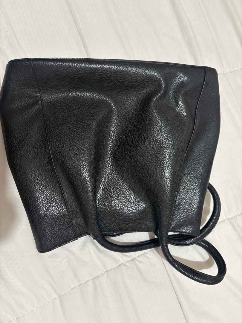 Tod's Black Leather Tote Bag (Category: Luxury Bags & Wallets) located in Manila. Submitted by nykji96 (Listing ID 1454813121, Image 3). Description: - Classic black leather tote from Tod's - Pebbled leather texture - Top handles for comfortable carrying - Spacious interior, ideal for daily essentials - Timeless design that complements any outfit - Authenticity guaranteed.