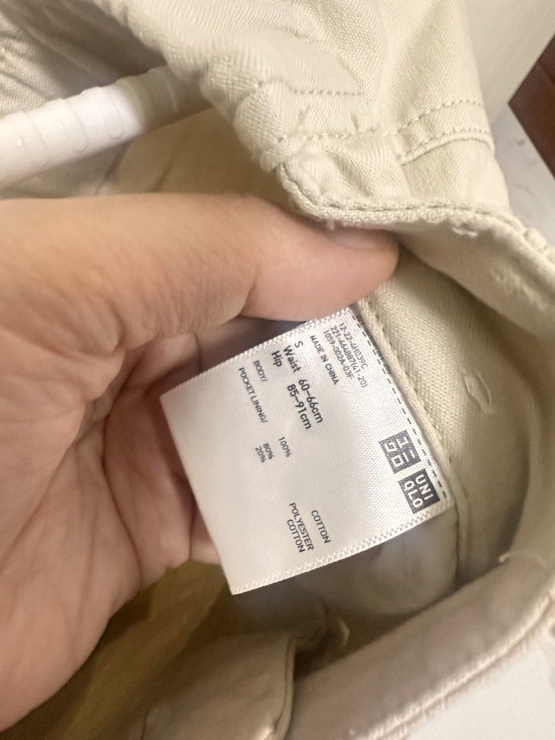 Uniqlo Beige Cargo Pants Size S (Category: Other Bottoms) located in Quezon City. Submitted by sammylicious (Listing ID 1454943436, Image 2). Description: - Uniqlo Beige Cargo Pants - Size: S - Waist: Fits 60-66cm - Hip: Fits 85-91cm - Material: Cotton (with polyester/cotton pocket lining) - Features: Elastic waistband, button and zip closure, multiple front and side pockets, back pocket detail - Style: Ideal for casual wear.