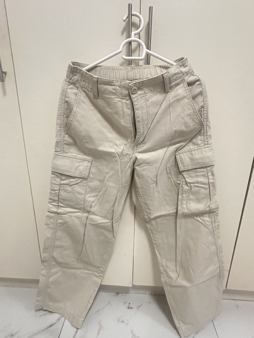 Uniqlo Beige Cargo Pants Size S (Category: Other Bottoms) located in Quezon City. Submitted by sammylicious (Listing ID 1454943436, Image 1). Description: - Uniqlo Beige Cargo Pants - Size: S - Waist: Fits 60-66cm - Hip: Fits 85-91cm - Material: Cotton (with polyester/cotton pocket lining) - Features: Elastic waistband, button and zip closure, multiple front and side pockets, back pocket detail - Style: Ideal for casual wear.