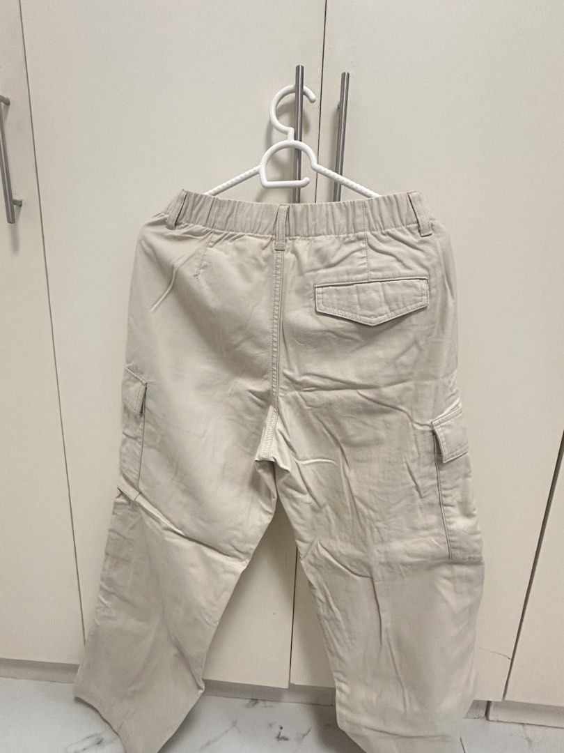 Uniqlo Beige Cargo Pants Size S (Category: Other Bottoms) located in Quezon City. Submitted by sammylicious (Listing ID 1454943436, Image 3). Description: - Uniqlo Beige Cargo Pants - Size: S - Waist: Fits 60-66cm - Hip: Fits 85-91cm - Material: Cotton (with polyester/cotton pocket lining) - Features: Elastic waistband, button and zip closure, multiple front and side pockets, back pocket detail - Style: Ideal for casual wear.