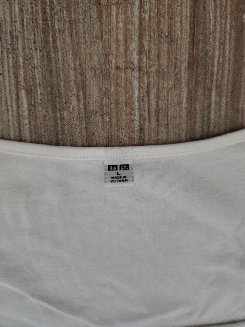 Uniqlo White Square Neck Shirt (Category: Shirts) located in Quezon City. Submitted by luckyvicky831 (Listing ID 1454895361, Image 2). Description: - White Uniqlo t-shirt - Square neckline - Short sleeves - Made in Vietnam - Basic and versatile, easy to pair with anything - Ideal for everyday wear.