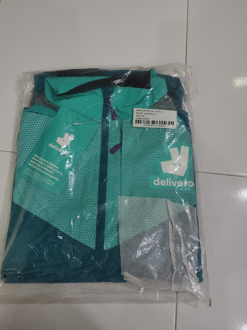 waterproof shell (Category: Motorcycle Accessories) located in Singapore. Submitted by dh6847 (Listing ID 1454863407, Image 1). Description: deliveroo rain coat.