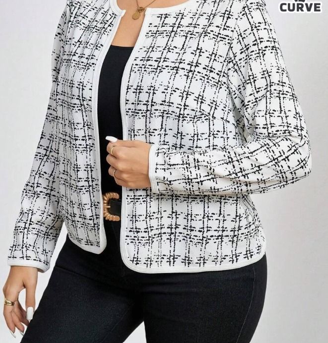 White and Black Plaid Open Front Jacket (Category: Coats, Jackets and Outerwear) located in Santa Cruz. Submitted by oddsandendsbitsandbobs (Listing ID 1454783101, Image 3). Description: RFS: Only used once for a speaking engagement. The original price was 316. - Chic white and black plaid jacket - Open front design with a clean neckline - Long sleeves - Ideal for a smart casual look - Comfortable and stylish.