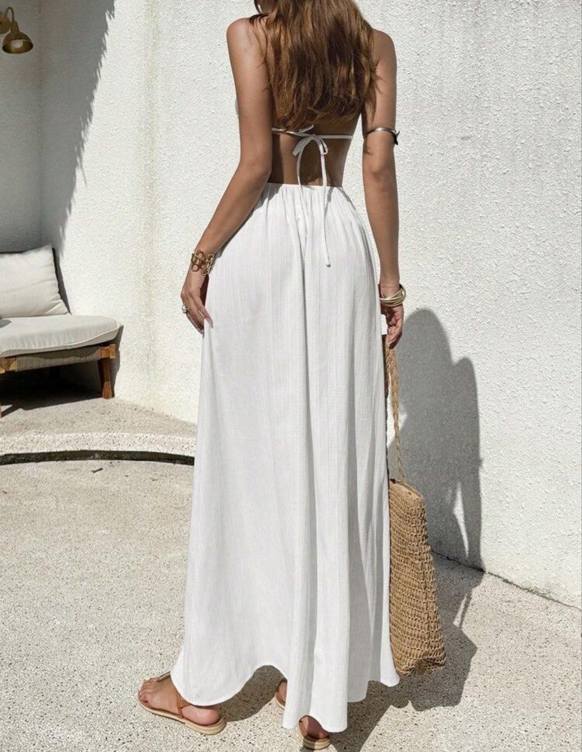 White Boho Halter Neck Maxi Dress with Shell Embellishments (Category: Dresses) located in Manila. Submitted by janamia (Listing ID 1454891679, Image 2). Description: - Flowy white halter neck maxi dress - Smocked waist with shell and gold bead details - Open back with tie closure - Ideal for beach vacations or summer events - Lightweight and comfortable fabric - Bohemian or coastal vibe.