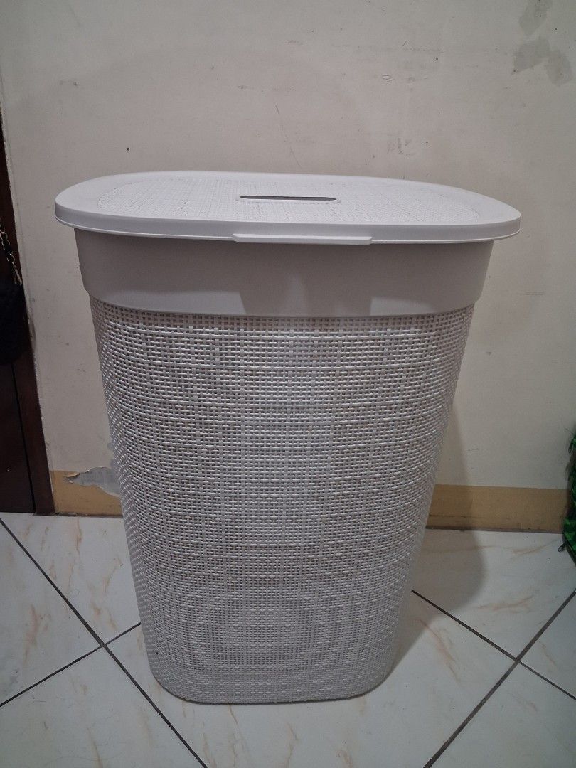 White Woven Laundry Basket with Lid (Category: Laundry Baskets) located in Caloocan City. Submitted by silentfox-8197 (Listing ID 1454838797, Image 1). Description: - White woven laundry basket - Oval shape - Comes with a lid featuring a handle cutout - Sturdy side handles for easy carrying - Ideal for laundry storage in any room.