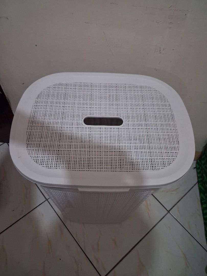 White Woven Laundry Basket with Lid (Category: Laundry Baskets) located in Caloocan City. Submitted by silentfox-8197 (Listing ID 1454838797, Image 2). Description: - White woven laundry basket - Oval shape - Comes with a lid featuring a handle cutout - Sturdy side handles for easy carrying - Ideal for laundry storage in any room.