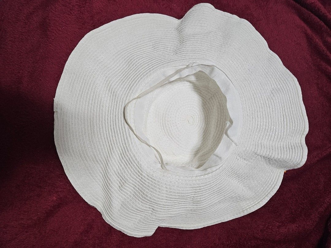 Wide Brim Sun Hat for Women (Category: Hats & Beanies) located in Caloocan City. Submitted by rm.diaz (Listing ID 1454903682, Image 2). Description: - Chic white wide brim sun hat - Ideal for beach trips and sunny days - Made from woven material - Folds easily for convenient storage - One size fits most - Stay protected from the sun in style!.
