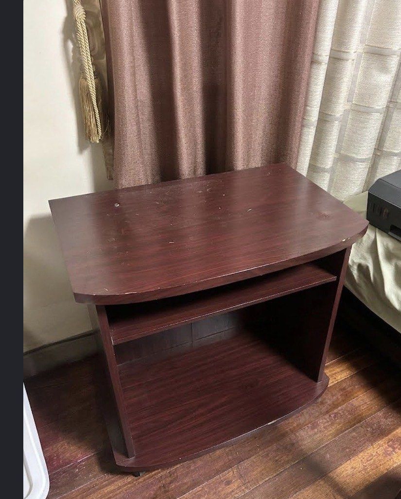 Wooden Side Table with Shelves (Category: Tables & Sets) located in Manila. Submitted by silverhawk.069da5 (Listing ID 1454779084, Image 2). Description: - Dark wood finish - Two open shelves for storage - Unique curved top surface - Ideal as a bedside table or accent piece - Versatile for any room - Lightweight and easy to move.