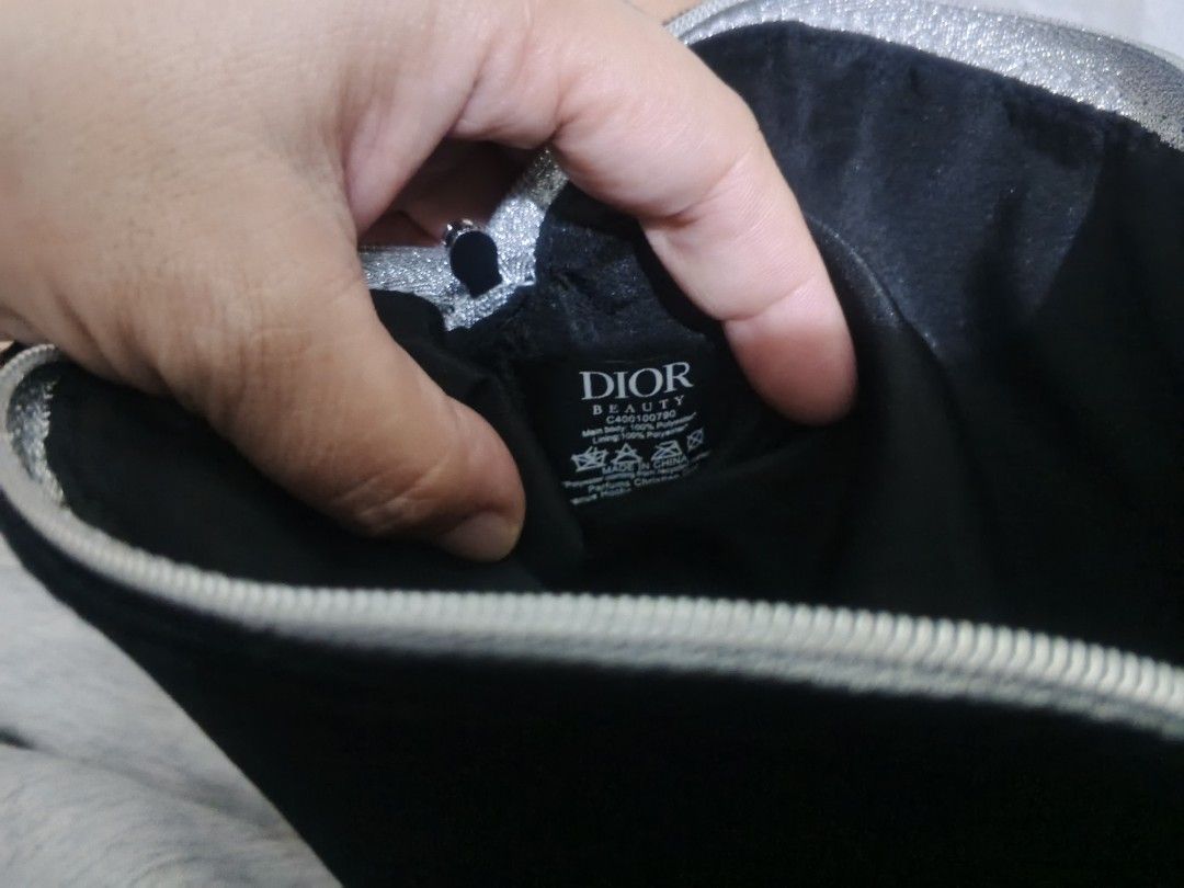 Y (Category: Luxury Bags & Wallets) located in Manila. Submitted by buywith_me (Listing ID 1454921989, Image 3). Description: - Authentic Black Dior Makeup Pouch - Luxurious Velvet Material - Includes Original Dior Box - Secure Zipper Closure - Ideal for Travel or Everyday Use - Interior Tag: 'DIOR BEAUTY CA400100'.