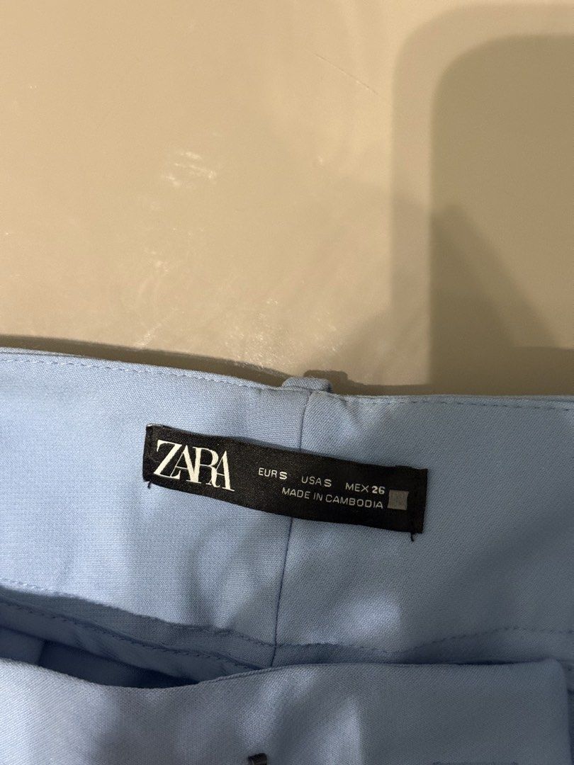 Zara Light Blue High-Waisted Trousers (Category: Other Bottoms) located in Manila. Submitted by qfclutz (Listing ID 1454805415, Image 3). Description: - Light blue trousers - High-waisted design - Straight leg cut - Functional pockets - Versatile for work or casual wear.