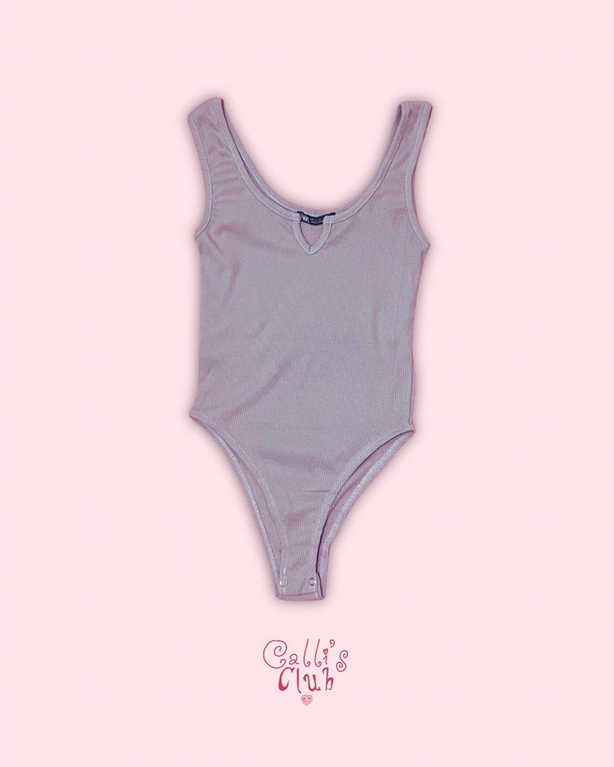 ZARA Ribbed V-Neck Bodysuit - Mauve (Category: Others Tops) located in Quezon City. Submitted by callist0 (Listing ID 1454937885, Image 2). Description: - Mauve ribbed bodysuit from ZARA - V-neckline with a small cutout detail - Sleeveless design - Snap closure at the bottom - Stretchy and comfortable material - Perfect basic piece for any wardrobe mop — gcash | bank transfer (Metrobank or BPI) delivery — through Grab express, Lalamove, Joyride, 