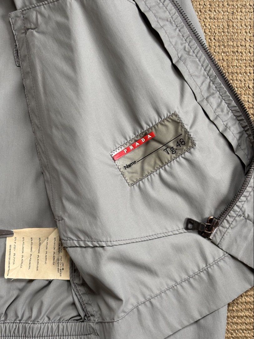 00s Prada Linea Rossa Technical Nylon Cafe Racer (Category: Coats, Jackets and Outerwear) located in Paranaque City. Submitted by grailonious (Listing ID 1455007258, Image 3). Description: Cropped fit cafe racer-style nylon jacket from 90s - early 2000s Prada Amazing condition except the singe stain on the front right pocket area All measurements posted.