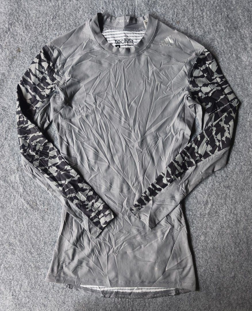 Adidas Techfit Long Sleeve Compression Shirt Grey Camo (Category: Activewear) located in Cagayan de Oro. Submitted by elijah350below (Listing ID 1455041377, Image 1). Description: - Grey Adidas Techfit long-sleeved shirt - Features black and grey camo pattern on sleeves - Climalite material for enhanced breathability - Ideal for workouts or as a layering piece - Slim fit design payment: Gcash, paymaya, maribank & LBP courier: J&T color may vary d