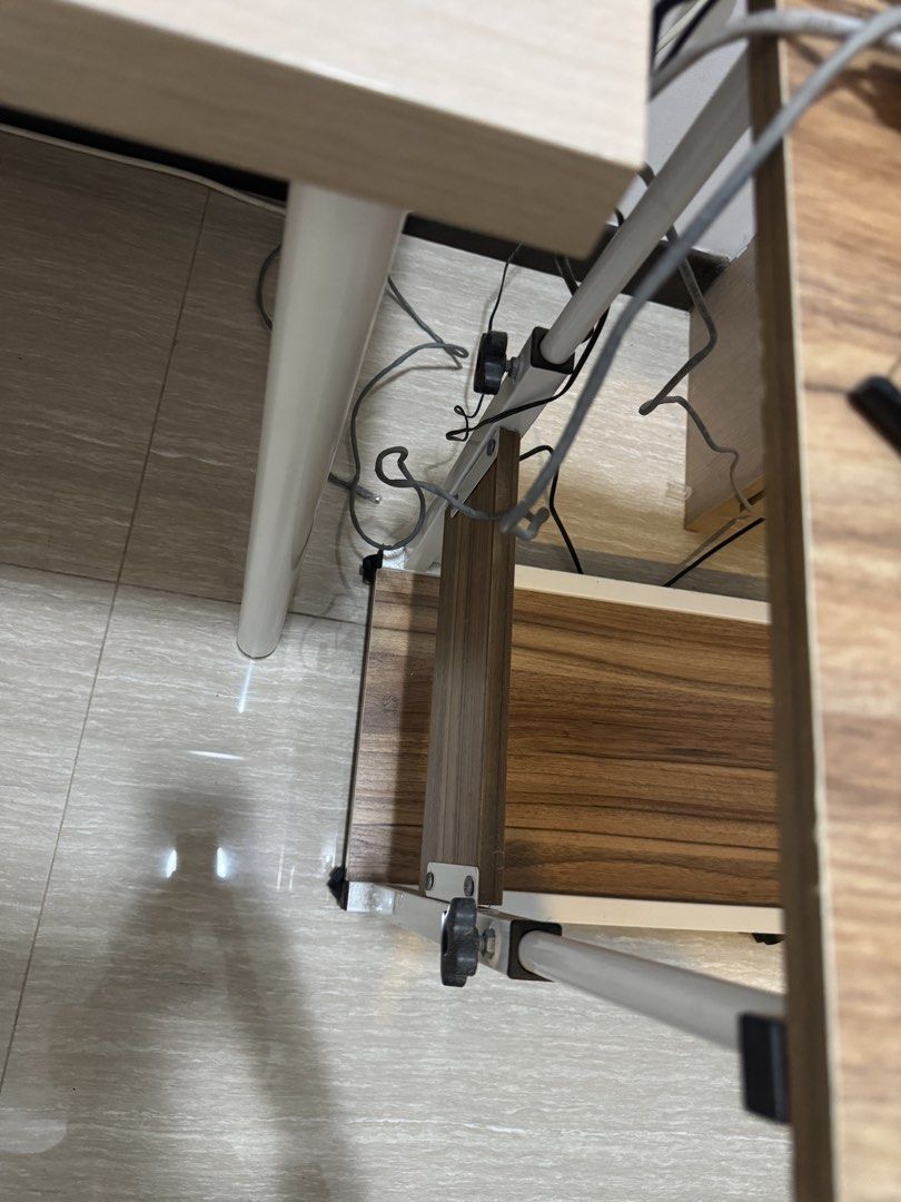 Adjustable Side Table (Category: Tables & Sets) located in Singapore. Submitted by ilyd. (Listing ID 1455109099, Image 3). Description: - Convenient side table - Adjustable height - Built-in shelf underneath for extra storage. - Equipped with wheels for easy mobility. - Ideal for laptops, or as a bedside table. - Collect by 22 August.