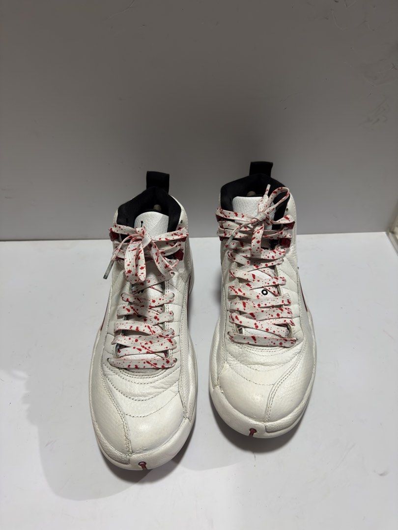 Air Jordan 12 Retro White Red Splatter (Category: Sneakers) located in Manila. Submitted by mislangers_stuff (Listing ID 1455139384, Image 3). Description: - Classic White and Red Air Jordan 12s - Features iconic Jordan 23 logo on the heel - Comes with unique splatter laces - A must-have for any serious Jordan collector.