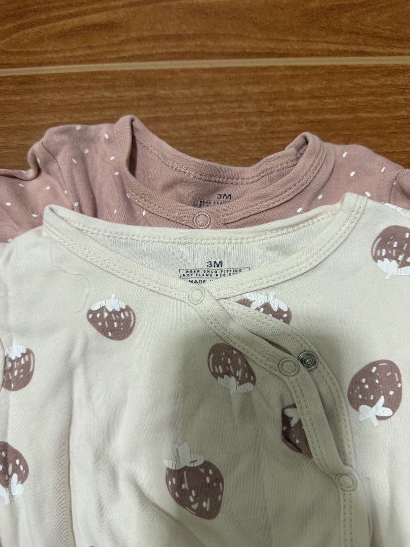 Baby Sleepsuits (Category: Babies & Kids Fashion) located in San Fernando. Submitted by epreloveditems (Listing ID 1455110763, Image 2). Description: - Set of 2 baby sleepsuits - Size: 3 months - Designs: Pink with white polka dots, Cream with strawberry print - Features: Long sleeves, footies, easy snap button closure - Ideal for: Everyday wear, sleep time.