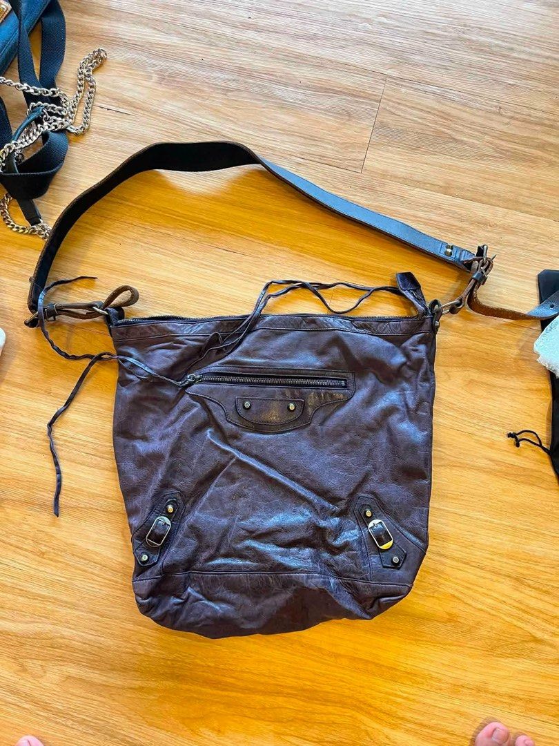 Balenciaga Purple Leather Shoulder Bag (Category: Luxury Bags & Wallets) located in Manila. Submitted by happywhale-0f64 (Listing ID 1454973751, Image 3). Description: - Authentic Balenciaga shoulder bag - Made in Italy - Genuine leather with a unique distressed look - Functional zippers and hardware - Spacious interior - Perfect for everyday designer style.