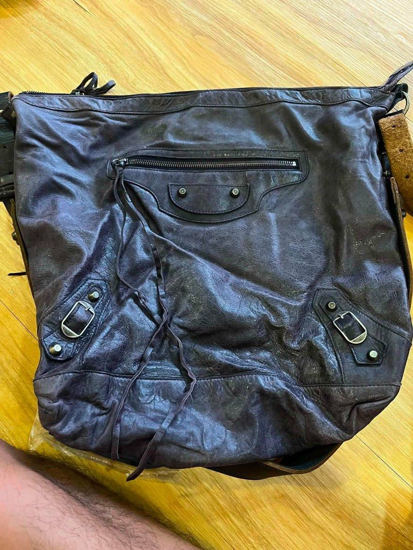 Balenciaga Purple Leather Shoulder Bag (Category: Luxury Bags & Wallets) located in Manila. Submitted by happywhale-0f64 (Listing ID 1454973751, Image 2). Description: - Authentic Balenciaga shoulder bag - Made in Italy - Genuine leather with a unique distressed look - Functional zippers and hardware - Spacious interior - Perfect for everyday designer style.