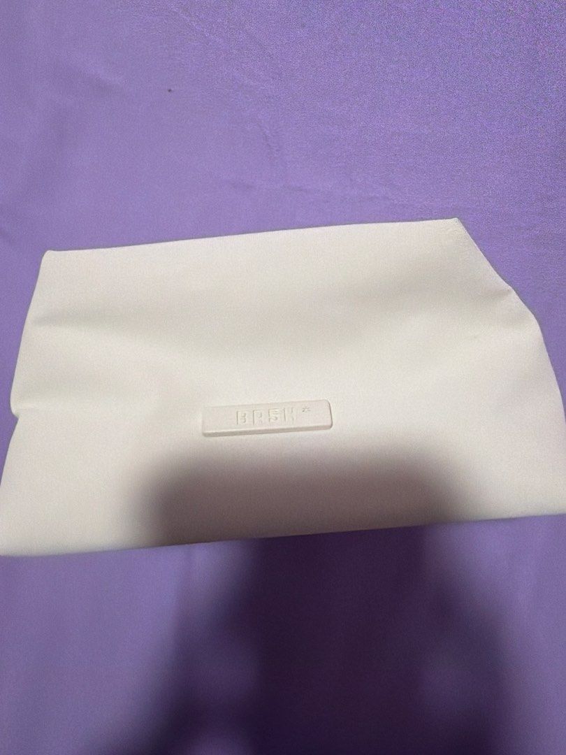 9.9 Sale BAsh Daily Sac Bag in Bone color (Category: Clutches) located in Morong. Submitted by Kaycer00 (Listing ID 1454988415, Image 3). Description: - Daily sac bag by Bash Manila make up pouch - Features a subtle embossed logo on the front - Lined interior with light-colored fabric - Secure zipper closure - Clean and versatile design, ideal for casual outings or events My onting stain lang that can be washed once lang ginamit sa siargao Manila