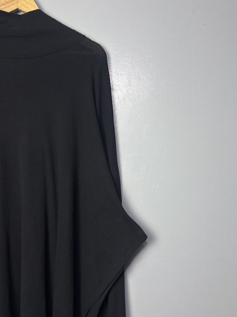 Black Turtleneck Long Sleeve Top (Category: Hoodies) located in Manila. Submitted by dipdrip (Listing ID 1455081363, Image 2). Description: - Long sleeve top - Turtleneck design - Unique wide cut sleeves - Flowing, relaxed silhouette - Made from soft, lightweight fabric - Ideal for layering or wearing on its own - Versatile addition to any wardrobe DIMENSIONS Width : 33 Length : 33 Sleeves : 29 Shoulder : 25.5 Hem : Measurements are in (INCHES) C