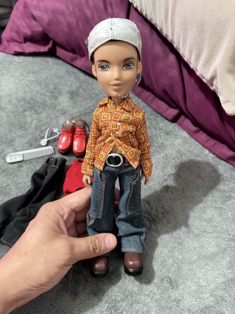 Bratz Doll (Bratz Boyz) (Category: Kids Toys) located in Manila. Submitted by mak1k0 (Listing ID 1454974075, Image 1). Description: - Bratz boy doll (Dylan) - Wears a cool patterned shirt, jeans, and cap - Comes with extra clothes: black pants and a red top - Includes accessories: red shoes, comb, necklace, sunglasses and backpack - Great for Bratz collectors or for playtime! - No Box just the doll and the accessories LOC: Antipolo City MOP: Gcas