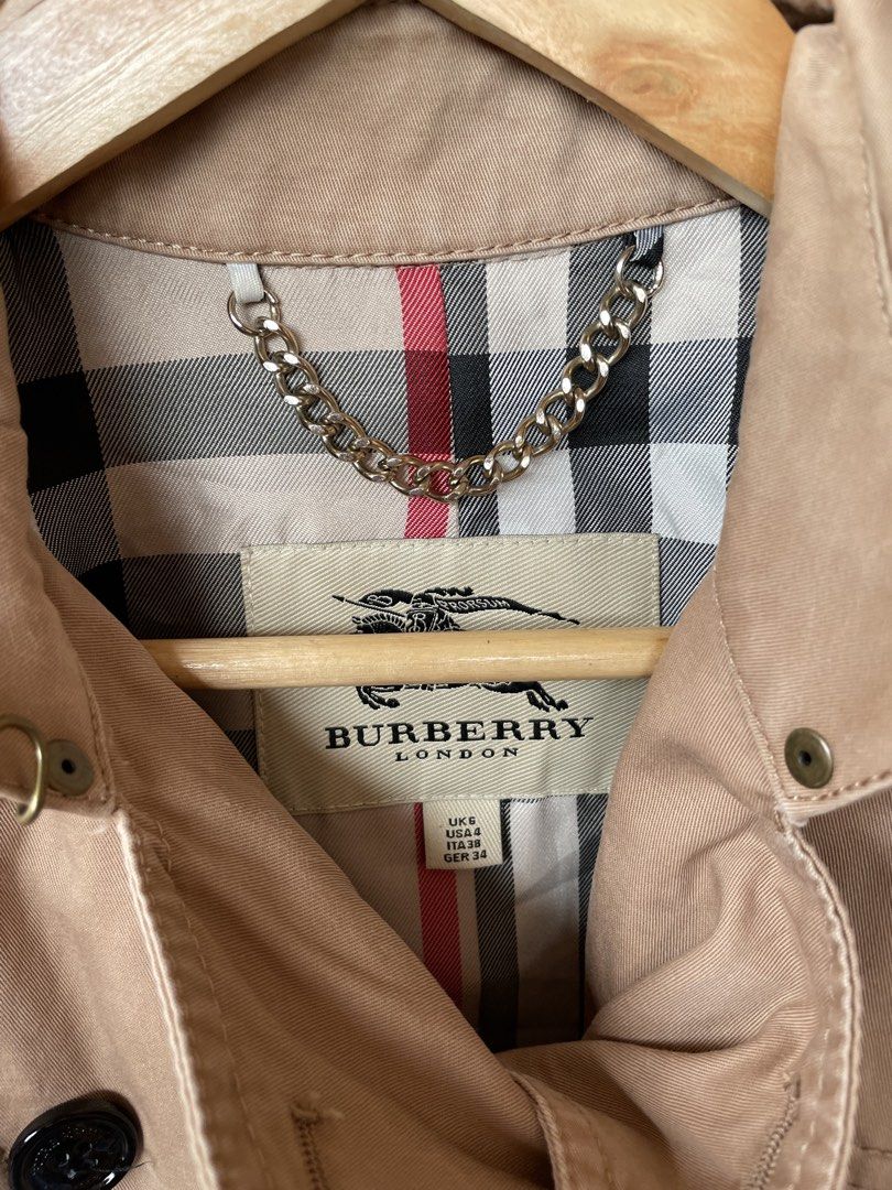 Burberry Trench Coat (Category: Luxury Apparel) located in Manila. Submitted by ajnd.thrift (Listing ID 1454955874, Image 2). Description: Burberry Trench Coat Size US 4 on Tag Very Good Condition .