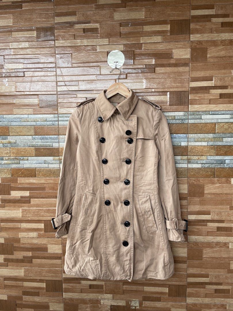 Burberry Trench Coat (Category: Luxury Apparel) located in Manila. Submitted by ajnd.thrift (Listing ID 1454955874, Image 1). Description: Burberry Trench Coat Size US 4 on Tag Very Good Condition .