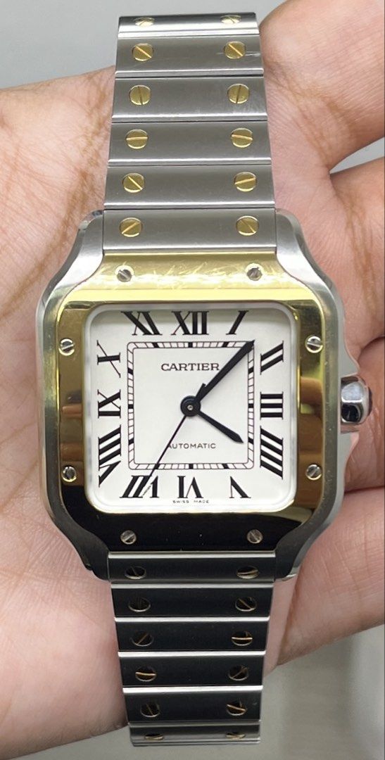 Cartier Santos De Cartier Medium 2tone (Category: Luxury Watches) located in Makati City. Submitted by itsyourwatches (Listing ID 1455009227, Image 2). Description: - Cartier Santos de Cartier Medium - 2tone (18k yellow/Stainless Steel - Movement: Automatic - Model Reference: W2SA0016 - Purchase Date: August 23, 2022 - Includes: Original Box, Warranty Card, Extra Leather Straps.