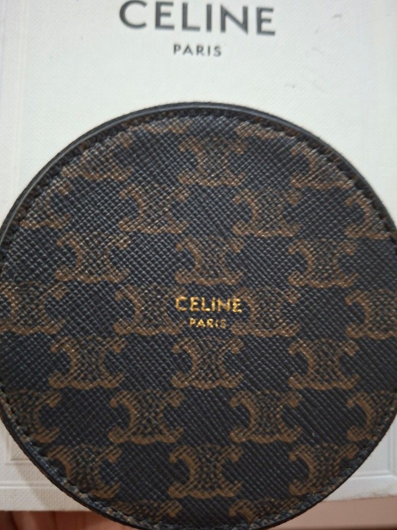 KEPT UNUSED Triomphe Canvas Round Coin Pouch with zipper (Category: Luxury Bags & Wallets) located in Mandaluyong City. Submitted by k__z__ (Listing ID 1454958167, Image 2). Description: - Authentic Celine coin pouch - Signature Triomphe canvas with monogram pattern - Includes original box and dust bag - Secure zipper closure (zipper still with intact cover) -smooth leather interior - Perfect for organizing small essentials.