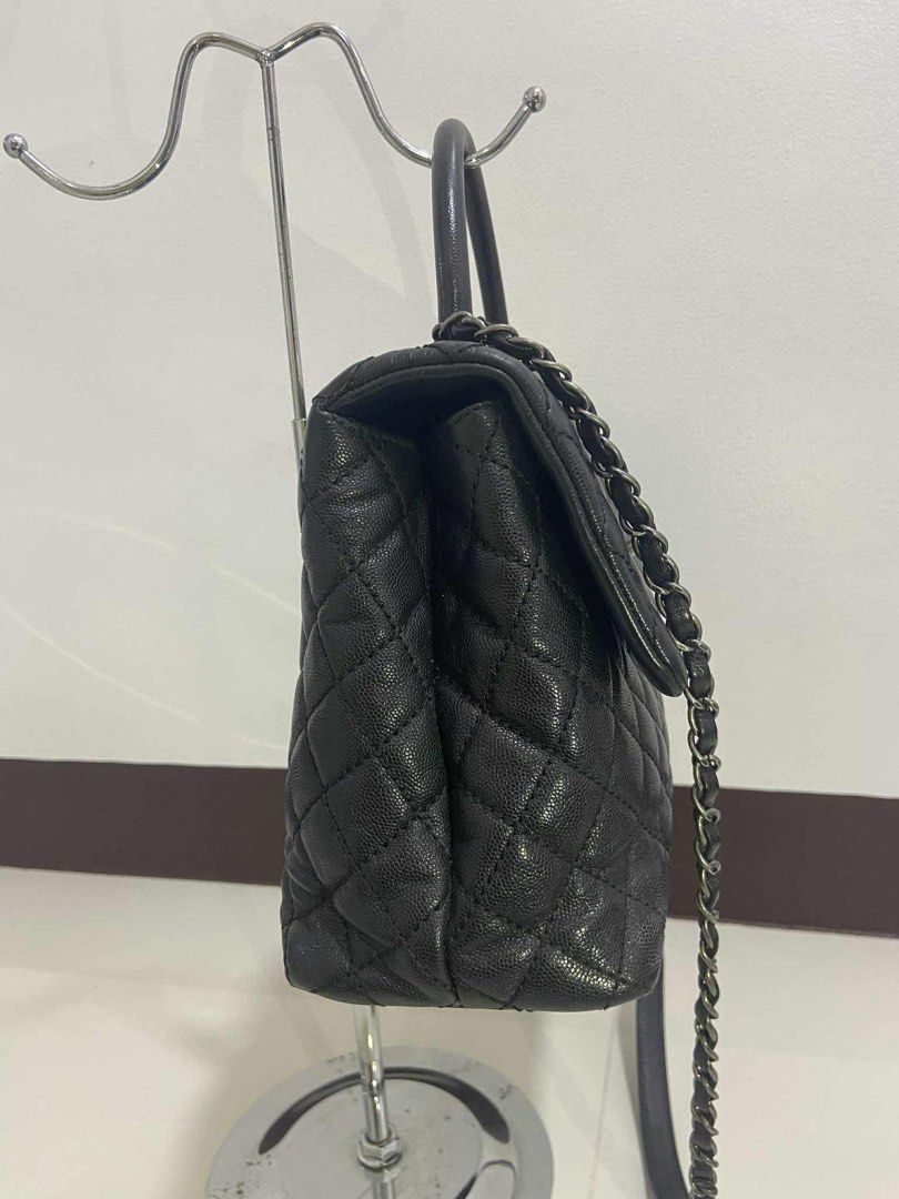 Chanel Black Caviar Coco Handle Bag (Category: Luxury Bags & Wallets) located in Davao. Submitted by makeupbynoeh (Listing ID 1455118314, Image 3). Description: - Chanel Black Caviar Large Coco Handle - Material: Black caviar leather, Series 22 - Hardware: Ruthenium (RHW) - Features: Top handle w/ undetachable chain strap - Includes: Authenticity card, dust bag, box, and ribbon - Versatile: Ideal for day or night use.