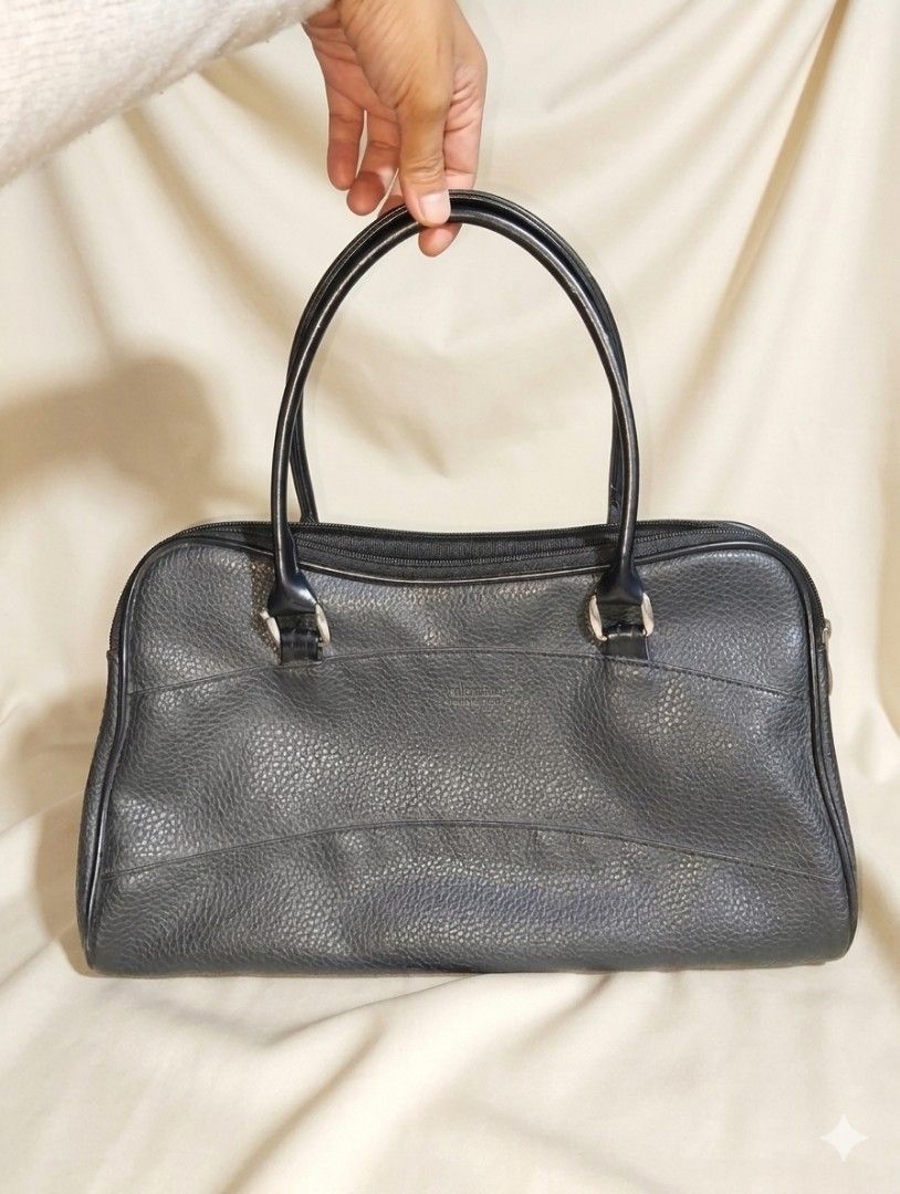 Christian Valmeline Black Leather Handbag (Category: Luxury Bags & Wallets) located in Pasig City. Submitted by kat_grande (Listing ID 1455028330, Image 2). Description: - Brand: Christian Valmelina - Color: Black - Material: Textured leather exterior, smooth interior - Closure: Zipper - Interior Features: 1 zippered pocket - Style: Classic everyday bag - Origin of Design: Italy.