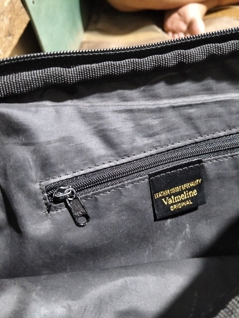 Christian Valmeline Black Leather Handbag (Category: Luxury Bags & Wallets) located in Pasig City. Submitted by kat_grande (Listing ID 1455028330, Image 3). Description: - Brand: Christian Valmelina - Color: Black - Material: Textured leather exterior, smooth interior - Closure: Zipper - Interior Features: 1 zippered pocket - Style: Classic everyday bag - Origin of Design: Italy.