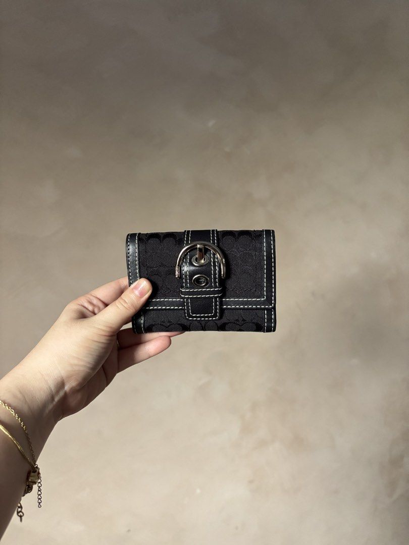 Coach MINI Soho Wallet (Category: Luxury Bags & Wallets) located in Calamba. Submitted by chrysanthemums.mnl (Listing ID 1454989314, Image 2). Description: Few minor scuffs at the edges as signs of use but other than that the item is good as new. You are paying for the condition of the item. Same day booking(j&t or lalamove) after payment.
