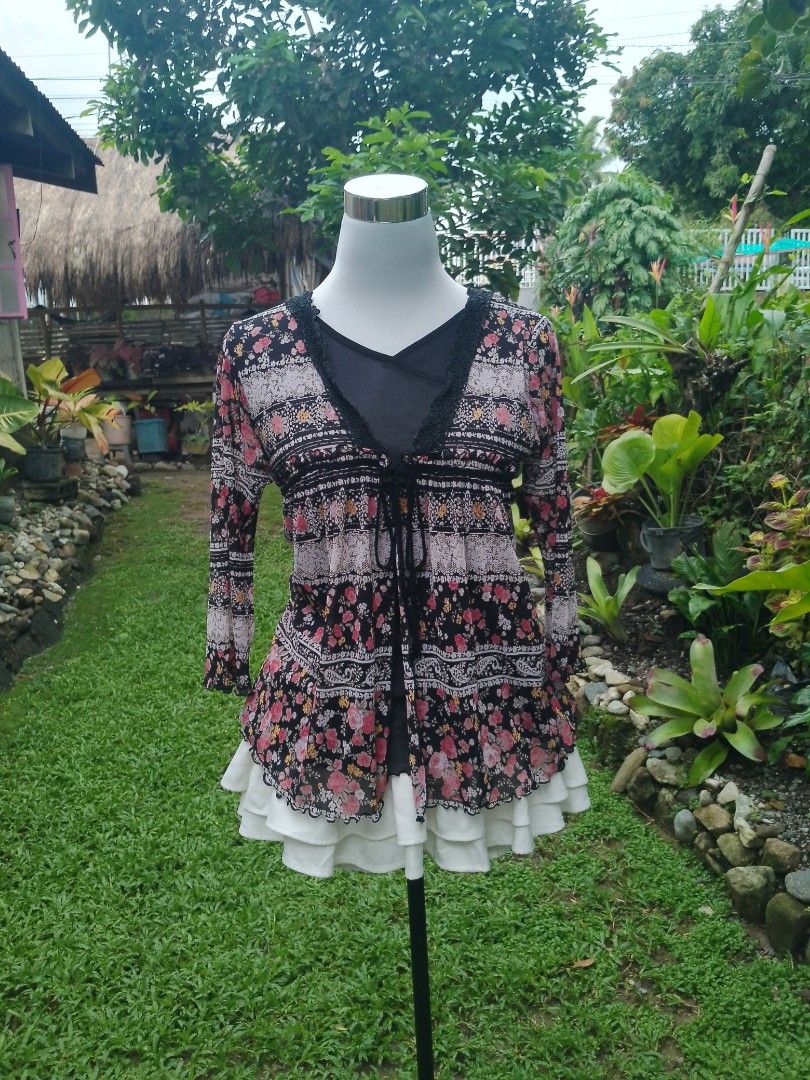 Common Sense Floral Sheer Long Sleeve (Category: Coats, Jackets and Outerwear) located in Laur. Submitted by zystilo (Listing ID 1455050000, Image 3). Description: - s-m - Sheer floral print cardigan from Common Sense - Features black lace trim - Tie front closure - Long bell sleeves - Ideal for boho or vintage looks - Adds a pop of color to any outfit.