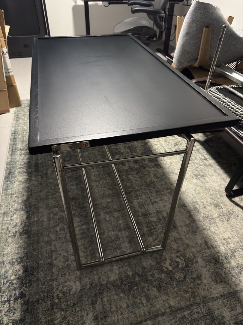 Convertable Coffee Table (Category: Tables & Sets) located in Singapore. Submitted by fai_6 (Listing ID 1455055501, Image 2). Description: - Sleek black coffee table - Convert from coffee table to small dining table - Shiny chrome frame/legs - Dimensions: 123cm (L) x 64cm (W) x 42cm (H) - Perfect for small living rooms #midcenturymodern #mcm #coffeetable #diningtable # bauhaus.