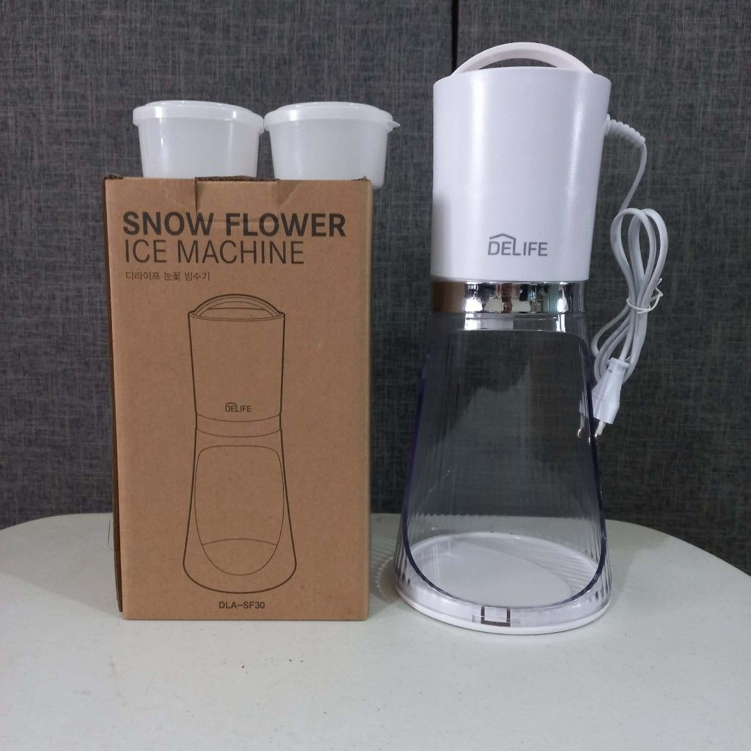 DELIFE Snow Flower Ice Machine DLA-SF30 (Category: Other Kitchenware & Tableware) located in Quezon City. Submitted by lui_gonzales (Listing ID 1455022484, Image 1). Description: - DELIFE Snow Flower Ice Machine (Model: DLA-SF30) - Perfect for making delicious shaved ice at home - Comes with two small cups - Easy to operate and clean - Ideal for cooling down on hot days - Get yours now!.