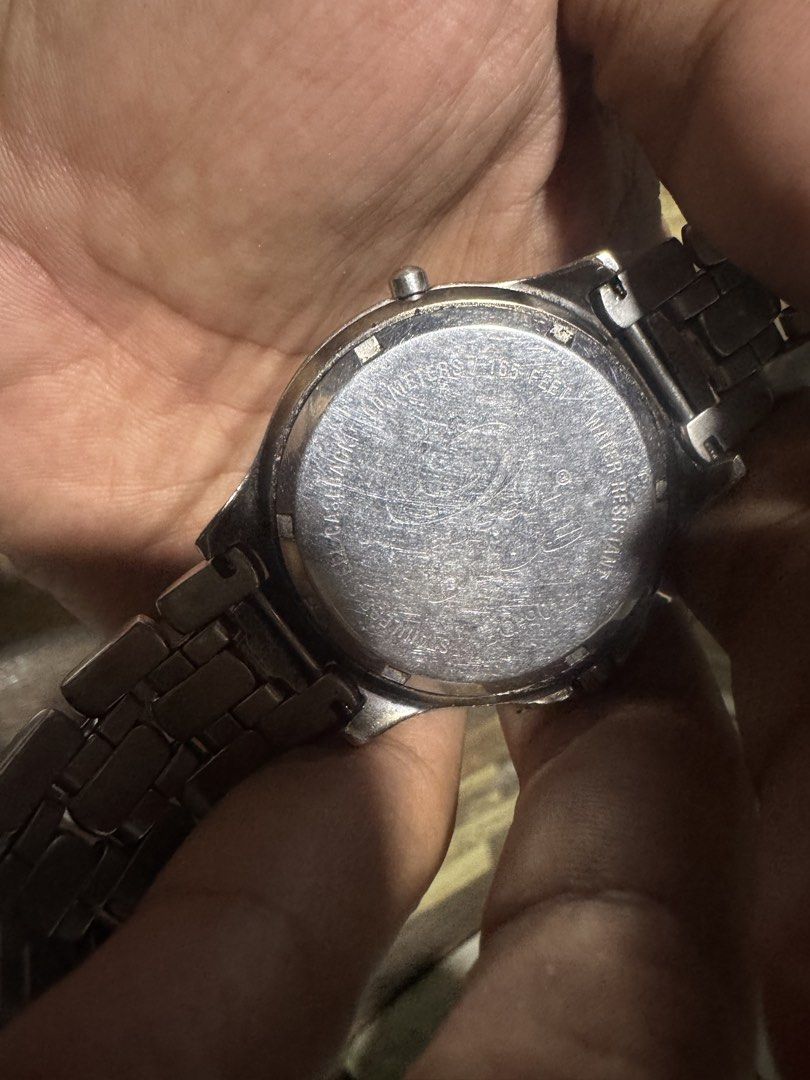 Fossil Watch Day Date Moon Phase Stainless Steel (Category: Men's Watches) located in Quezon City. Submitted by angace13 (Listing ID 1454987634, Image 3). Description: - Fossil watch with day, date, and moon phase complications - Durable stainless steel band and case - Water resistant up to 50 meters - Shows some signs of wear on the band and bezel, adding character - A cool and functional timepiece with multiple features.