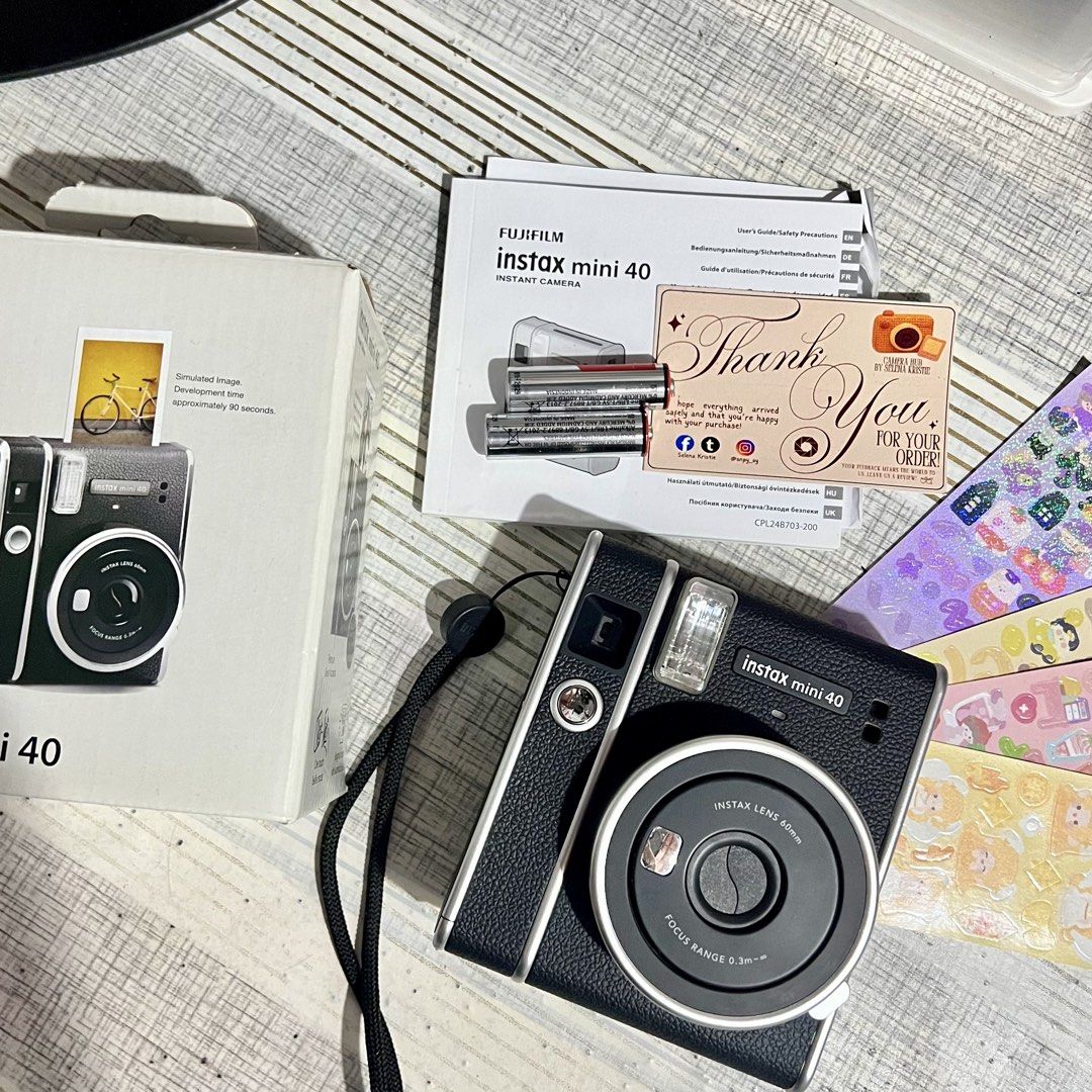 Fujifilm Instax Mini 40 (Category: Announcements) located in Makati City. Submitted by CameraHubPH (Listing ID 1455042500, Image 2). Description: 🎀 Fujifilm Instax Mini 40 Instant Camera 🎀 ✨ Classic Black / Charcoal Black Color 🖤 ✨ 100% Working | Fully Tested ✨ Cute vintage-inspired design ✨ Perfect for everyday memories, travel, gifts & journaling 📸🎞️ 📦 INCLUSIONS: ♡ Fujifilm Instax Mini 40 Unit ♡ Original Box ♡ Original User Guide / Manua