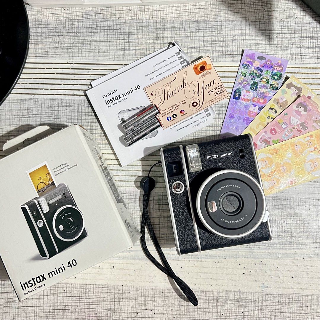 Fujifilm Instax Mini 40 (Category: Announcements) located in Makati City. Submitted by CameraHubPH (Listing ID 1455042500, Image 1). Description: 🎀 Fujifilm Instax Mini 40 Instant Camera 🎀 ✨ Classic Black / Charcoal Black Color 🖤 ✨ 100% Working | Fully Tested ✨ Cute vintage-inspired design ✨ Perfect for everyday memories, travel, gifts & journaling 📸🎞️ 📦 INCLUSIONS: ♡ Fujifilm Instax Mini 40 Unit ♡ Original Box ♡ Original User Guide / Manua