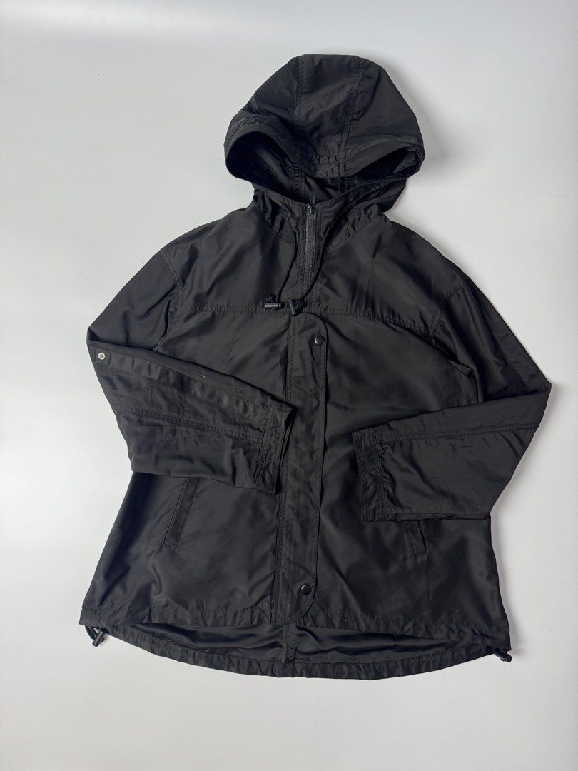 GU Black Hooded Lightweight Jacket (Category: Coats, Jackets and Outerwear) located in Cavite. Submitted by dracokidstuff (Listing ID 1455139155, Image 3). Description: - Black GU jacket with attached hood - Lightweight material, ideal for layering or mild weather - Full zip-up front with snap button closures - Features both front and internal pockets - Adjustable drawstring hem for a customized fit - Button tab closures on sleeve cuffs - Compact