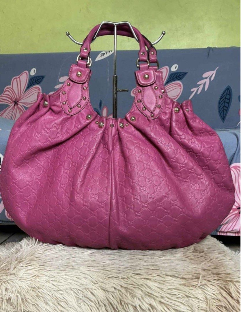 Guccissima Studded Hobo Handbag (Category: Luxury Bags & Wallets) located in Manila. Submitted by happytree.8a64d5 (Listing ID 1455050565, Image 1). Description: - its a. Authentic Pink Gucci Hobo Bag - Classic GG monogram embossed all over leather - Gathered detail at the top with gold stud accents - Interior zip pocket and Gucci tag - Sturdy handles with some signs of wear - Stylish and practical for everyday use - rfs: i need to let go of her 
